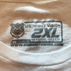 Close up of the tag less inner collar on the white US Night Vision Branded T-Shirt showing the printed brand logo and sizing details