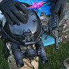 Tactical loadout featuring a night vision helmet setup alongside a rifle equipped with the DIR-ONE infrared laser aiming device