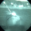 Through the tube night vision view demonstrating the powerful beam of the DIR-ONE infrared aiming laser on downrange targets