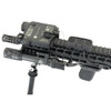 Close up angled view of the black USNV Advanced Mission Ready Kit mounted on a rifle handguard showing the Emissary Alternator integration