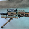Side profile view of the FDE USNV Advanced Mission Ready Kit mounted to a tactical rifle rail system