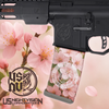 Close up view of the Cherry Blossom pattern Mag Wraps vinyl decal skin installed on an AR-15 magazine