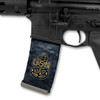 Side profile of an AR-15 lower receiver showing a tactical magazine customized with the black and white US Navy logo Mag Wraps decal skin