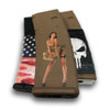 Display of customized tactical magazines highlighting the Hot Shots 2013 Rosie Mag Slaps decal on a flat dark earth AR-15 magazine