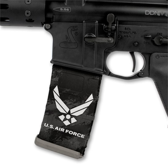 Side profile of an AR-15 lower receiver showing a tactical magazine customized with the black and white US Air Force logo Mag Wraps decal skin