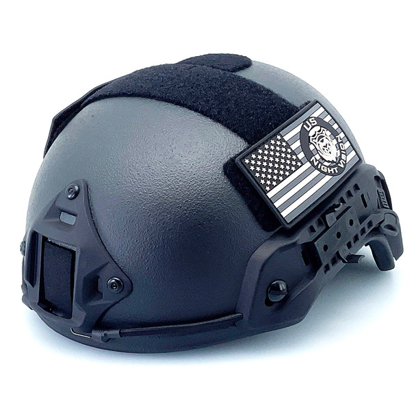 Angled left profile of the USNV FAST Ballistic Helmet Level IIIA Protection in black featuring side rails and hook and loop fields