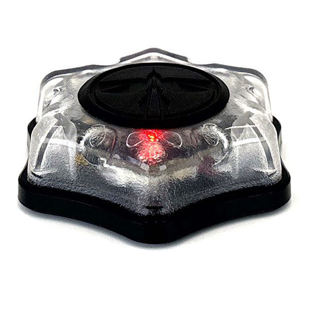 Angled front view of the compact HRT Tactical Marker Light showing the durable housing and top activation button
