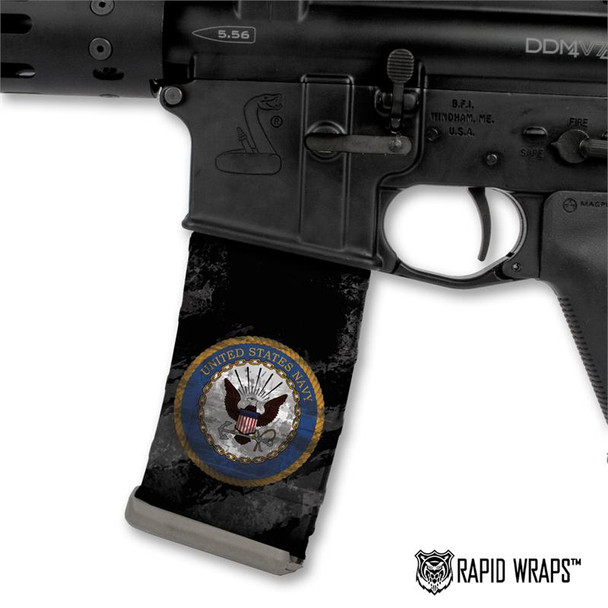Side profile of an AR-15 lower receiver showing a tactical magazine customized with the black and white US Navy logo Mag Wraps decal skin