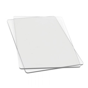 Sizzix Accessory - Cutting Pads, Standard, 1 Pair (655093)
This pair of Cutting Pads was specially designed for use in the BIGkick, Big Shot and Vagabond machines. Constructed of high-quality polycarbonate plastic, these see-through Cutting Pads allow for easy die-cutting of Sizzix steel-rule dies (Bigz, Movers & Shapers, Originals and ScoreBoards) in the BIGkick, Big Shot and Vagabond machines. Simply sandwich the die and material to be cut between the Cutting Pads and roll through the machine. A Premium Crease Pad may be needed in place of one Cutting Pad when die-cutting Sizzix steel-rule dies containing crease rule. Sizzix Accessory - Cutting Pads, Standard, 1 Pair (655093)
This pair of Cutting Pads was specially designed for use in the BIGkick, Big Shot and Vagabond machines. Constructed of high-quality polycarbonate plastic, these see-through Cutting Pads allow for easy die-cutting of Sizzix steel-rule dies (Bigz, Movers & Shapers, Originals and ScoreBoards) in the BIGkick, Big Shot and Vagabond machines. Simply sandwich the die and material to be cut between the Cutting Pads and roll through the machine. A Premium Crease Pad may be needed in place of one Cutting Pad when die-cutting Sizzix steel-rule dies containing crease rule.