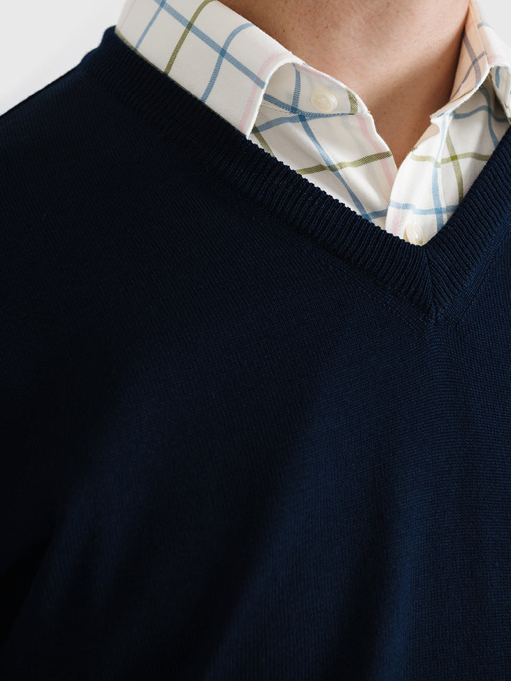 Men's Navy Blue Merino Wool V-Neck Jumper Closeup On Model