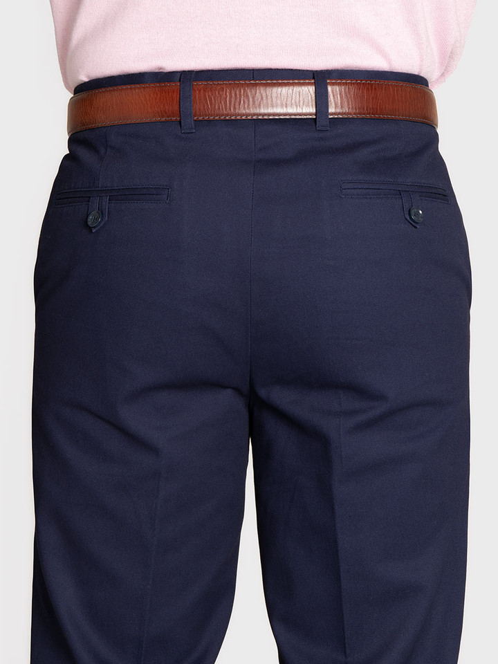 Men's Navy Blue Slim Fit Chino Trousers On Model Closeup Back