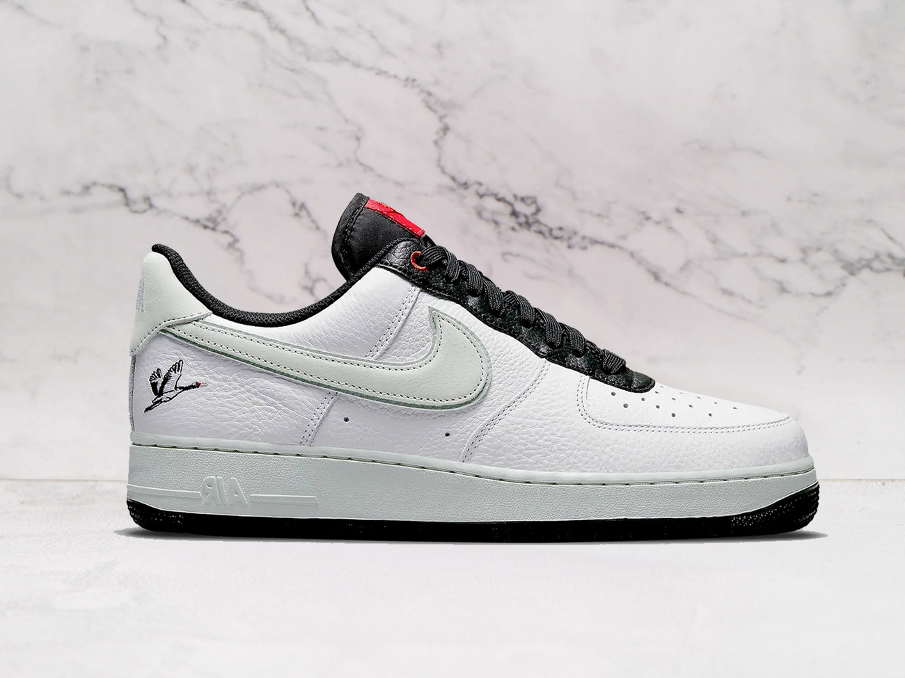Nike Air Force 1 Low 'Milky Stork' – White Leather Upper with Black Accents and Embroidered Stork on Heel