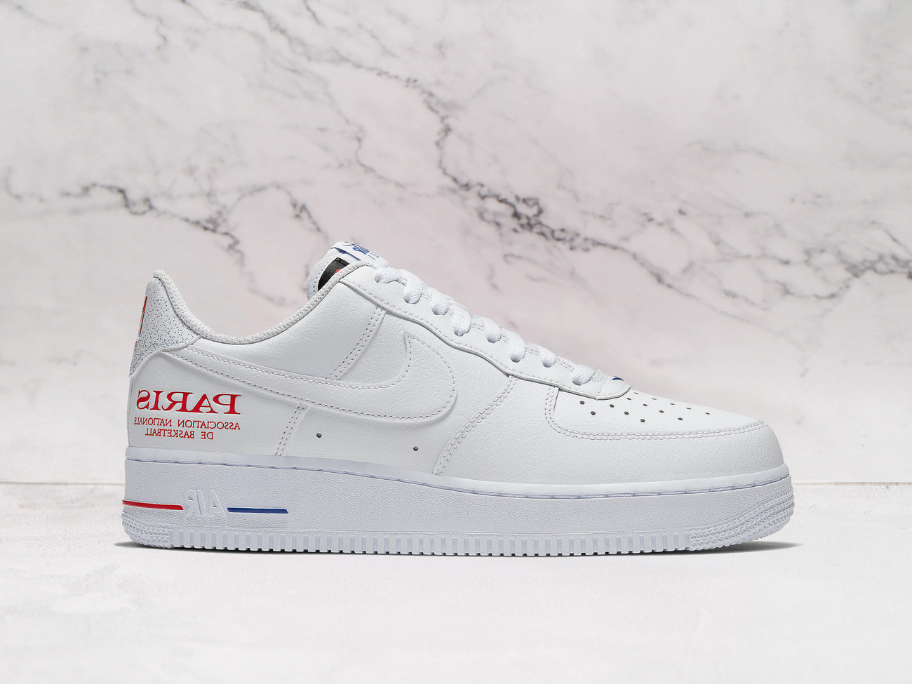 Nike Air Force 1 Low 'NBA Paris Game' – White Leather Upper with NBA Paris Branding and Red/Blue Midsole Accents