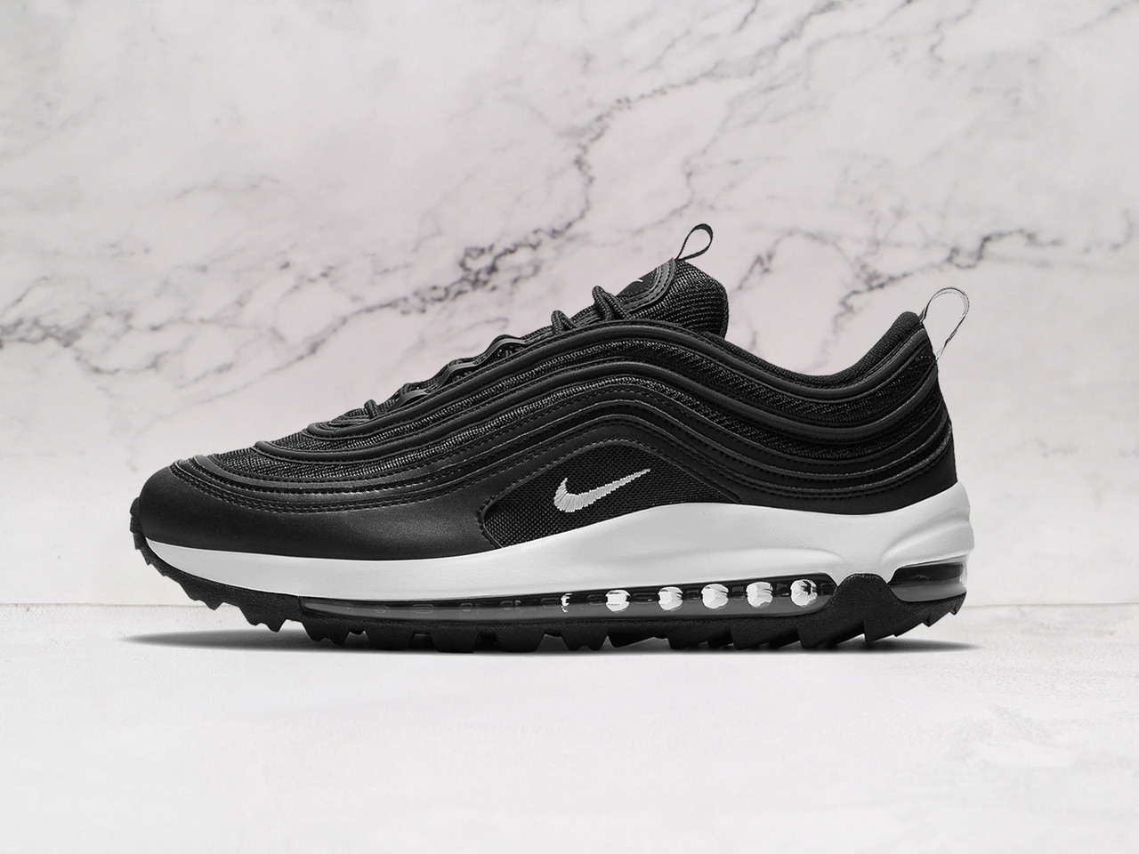 Nike Air Max 97 Golf Black White side profile featuring a sleek black synthetic upper, white midsole, and modified golf outsole for superior grip and waterproof performance