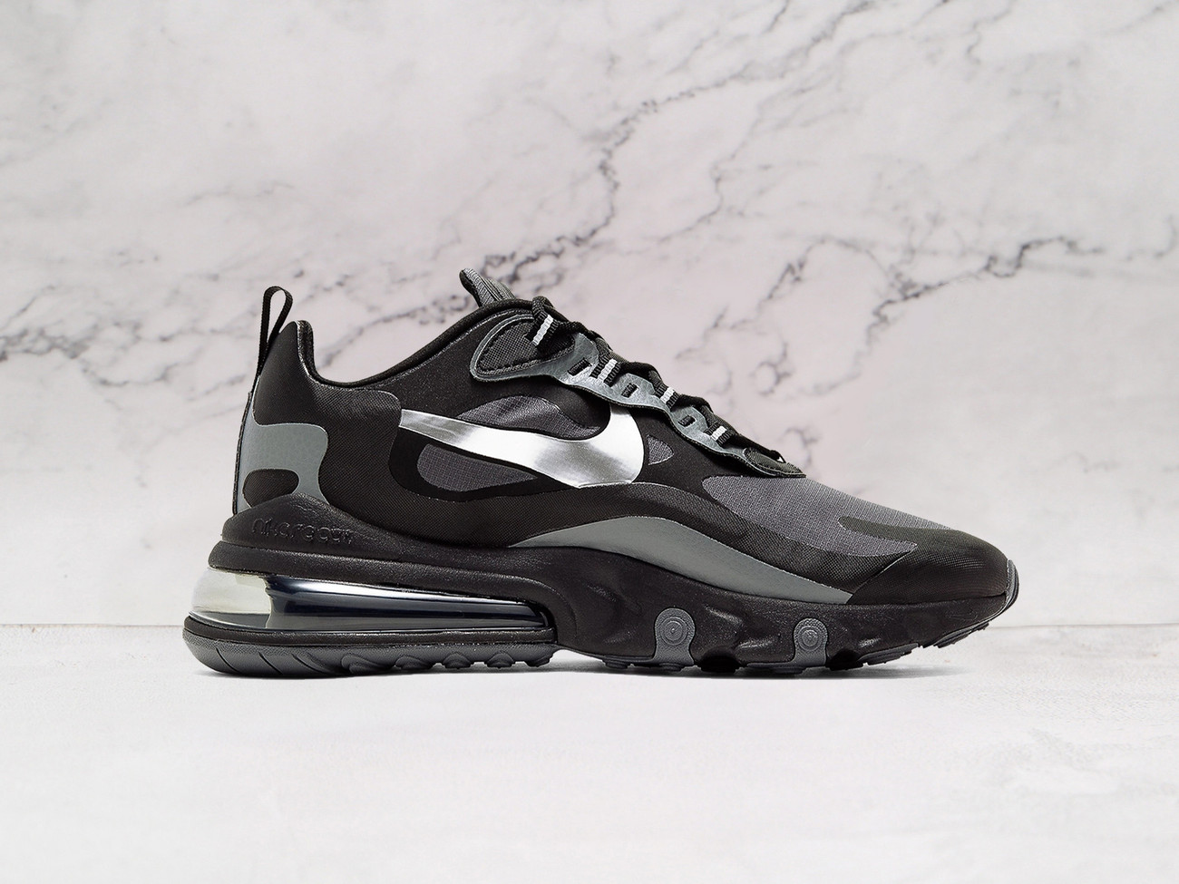 Nike Air Max 270 React Winter Black Dark Grey medial angle showcasing durable no-sew overlays, a rugged rubber outsole for enhanced traction, and insulated materials for cold-weather wear