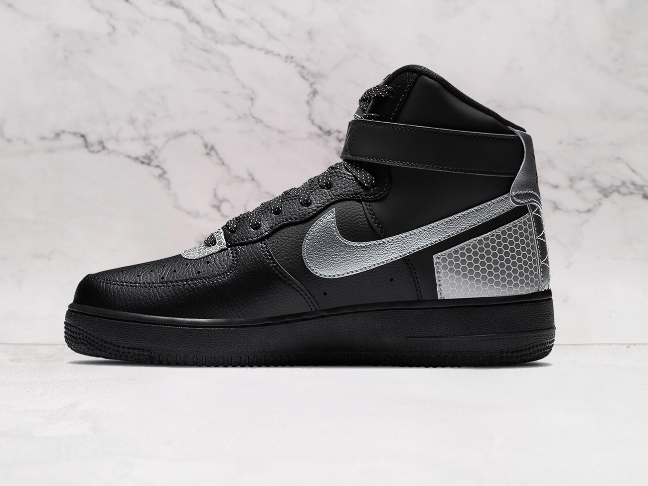Black Nike AF1 High medial view with 3M overlays and silver tongue tab.