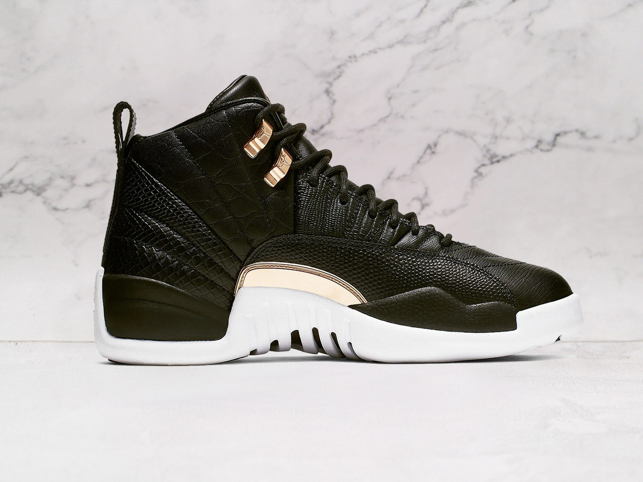 Medial view of Air Jordan 12 Retro Reptile with white sole
