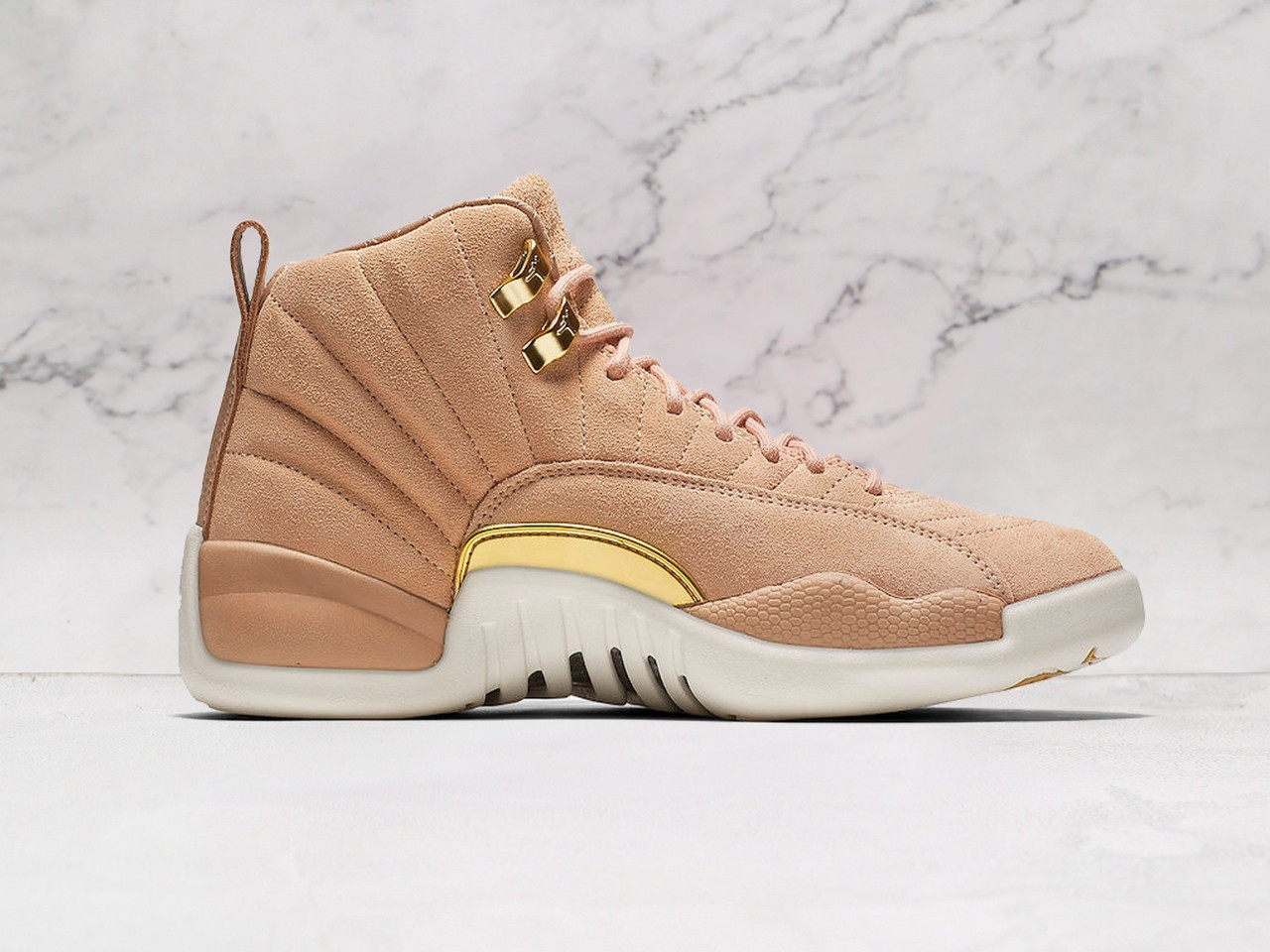 Medial view of Air Jordan 12 Retro 'Vachetta Tan' with quilted suede and Sail outsole