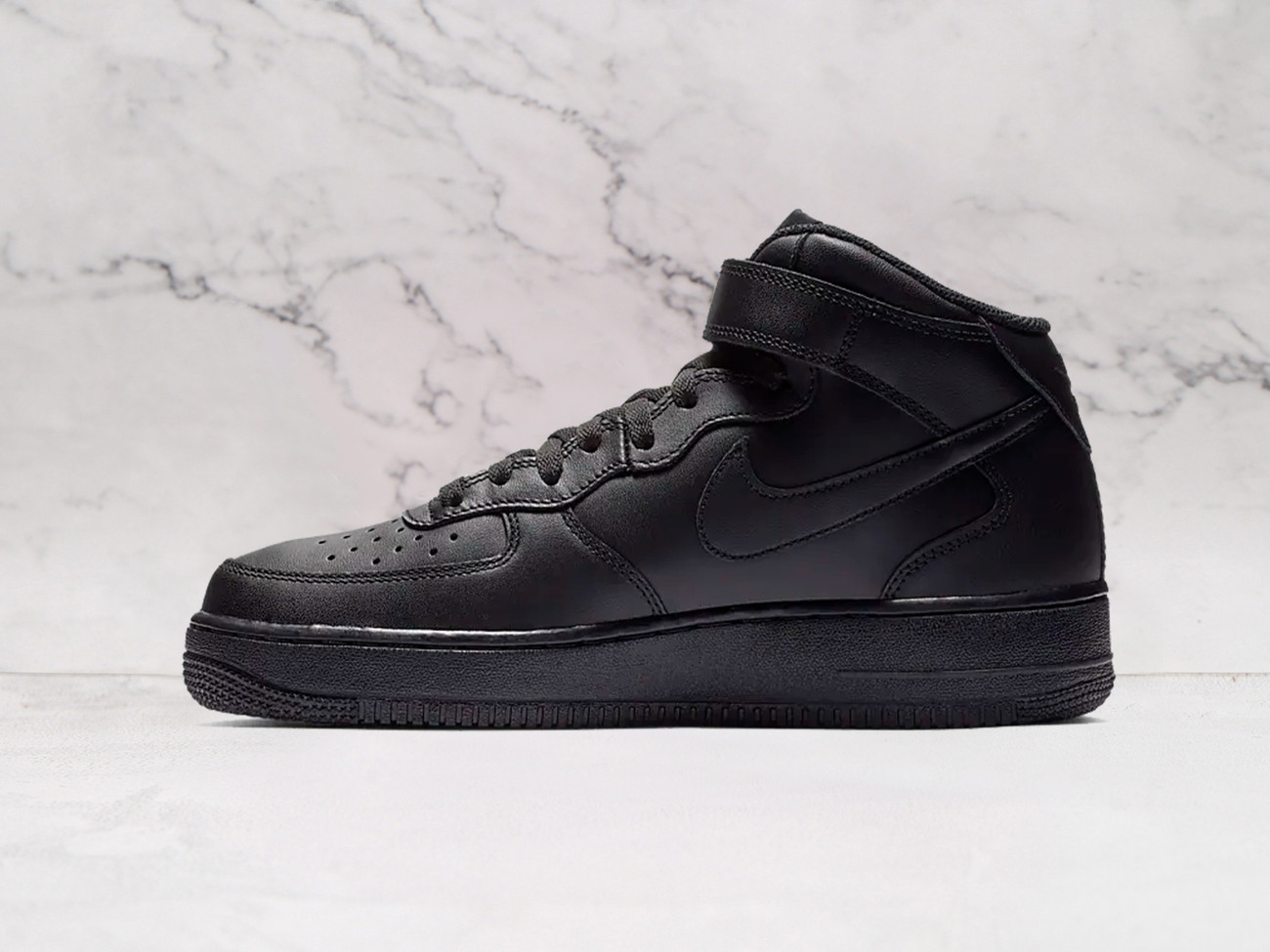 Triple Black Nike Air Force 1 Mid medial view with black leather and outsole