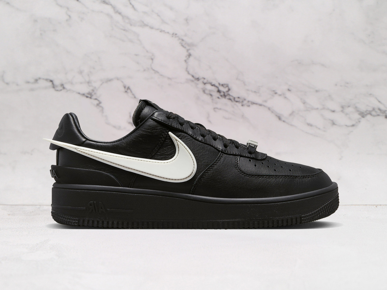 Nike Air Force 1 Low SP AMBUSH Black sneaker with oversized Swoosh.