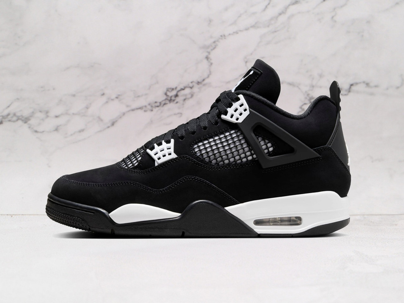 Jordan 4 Retro White Thunder Sneaker - Black and White Colorway