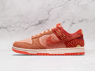 Nike Dunk Low Winter Solstice 2021 – Lateral side view showcasing the vibrant Team Orange and Crimson Bliss colorway with intricate sunray embroidery on premium leather overlays