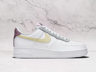 Nike Air Force 1 '07 White Lemon Drop Regal Pink – White leather upper with Lemon Drop yellow Swoosh and Regal Pink back tab