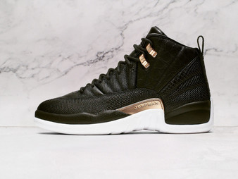 Side of Air Jordan 12 Retro Reptile with snakeskin prints and gold.