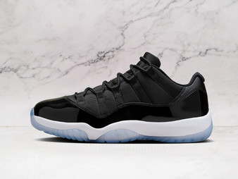Side view of Jordan 11 Low Space Jam with Black patent leather mudguard and ballistic mesh upper