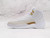 Side view of Air Jordan 12 Retro 'OVO White' with White tumbled leather and Metallic Gold eyelets