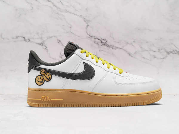 Nike Air Force 1 LV8 'Go The Extra Smile' – White Leather Upper with Black Cracked Leather Swoosh, Yellow Laces, and Smiley Face Graphics on Heel
