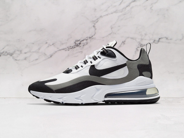 Nike Air Max 270 React White Black Metallic Pewter side profile featuring a sleek white upper with black and metallic pewter accents, a lightweight React foam midsole, and an oversized Air Max heel unit for ultimate comfort