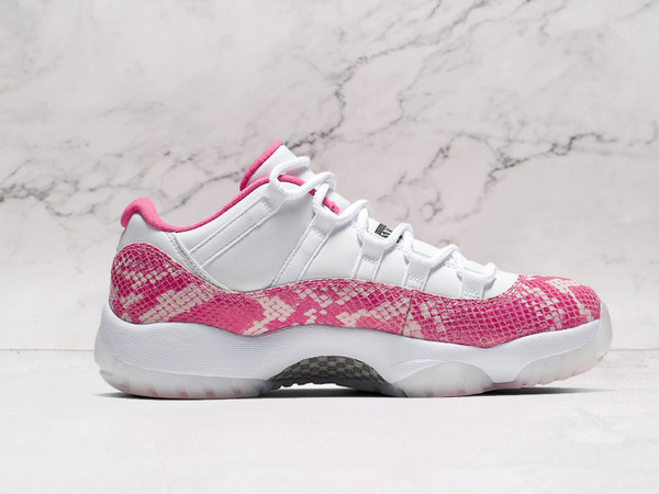 Medial view of Air Jordan 11 Retro Low 'Pink Snakeskin' showcasing Pink snakeskin detail and White leather