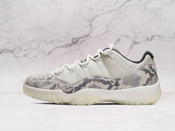 Side view of Air Jordan 11 Retro Low 'Light Bone Snakeskin' with Light Bone leather and snakeskin vinyl overlay