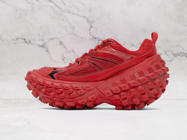 Red Balenciaga shoes featuring bold platform sole and high-fashion aesthetic