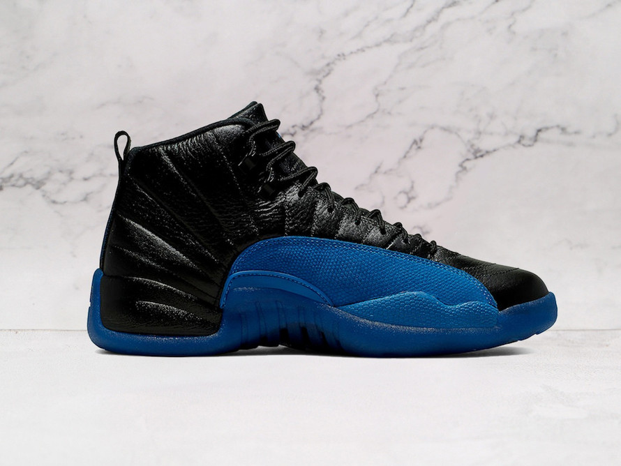 Medial view of Air Jordan 12 Retro Black Game Royal with royal sole.