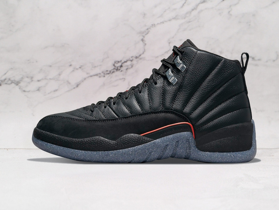Air Jordan 12 Retro Utility Grind side flex in black leather.