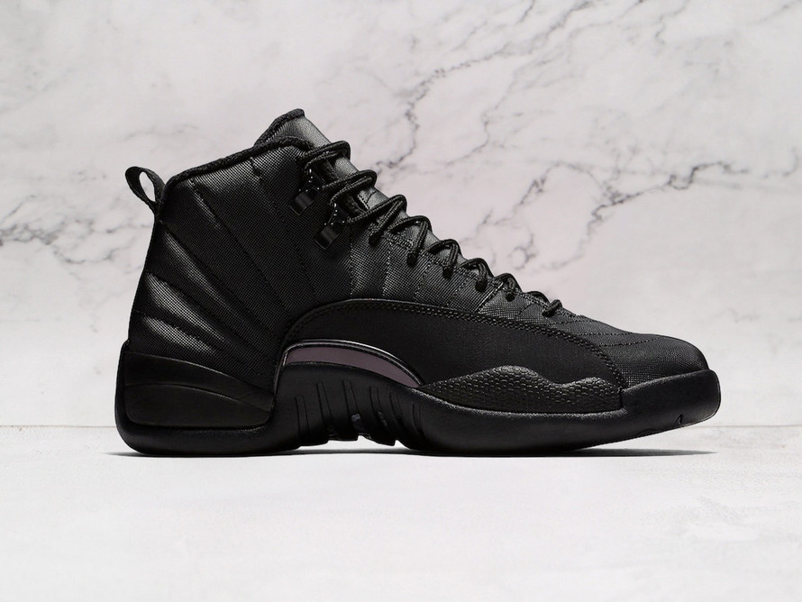 Medial view of Air Jordan 12 Retro Winter Black with terry cloth liner and rugged lugged outsole