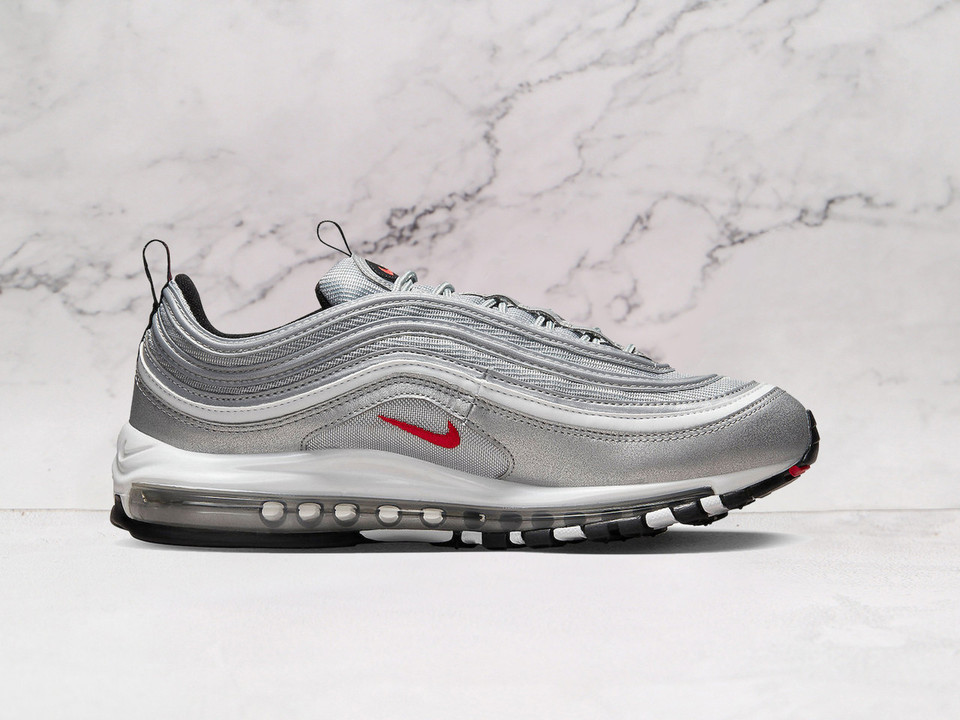 Nike Air Max 97 Silver Bullet medial angle showcasing mesh underlays, wavy design lines, and full-length Air unit for ultimate cushioning and comfort Nike Air Max 97 Silver Bullet medial angle showcasing mesh underlays, wavy design lines, and full-length Air unit for ultimate cushioning and comfort