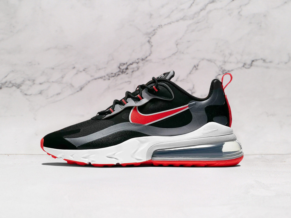 Nike Air Max 270 React Black Bright Crimson side profile featuring a sleek black upper with bold bright crimson accents, a lightweight React foam midsole, and an oversized Air Max heel unit for responsive cushioning Nike Air Max 270 React Black Bright Crimson side profile featuring a sleek black upper with bold bright crimson accents, a lightweight React foam midsole, and an oversized Air Max heel unit for responsive cushioning