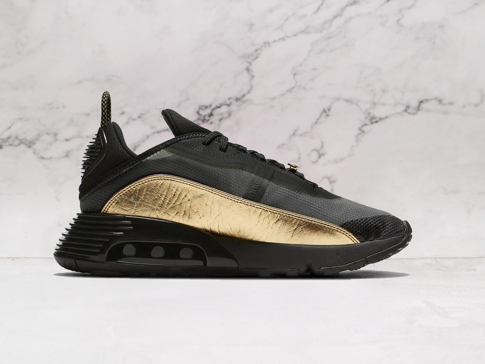 Nike Air Max 2090 Black Metallic Gold medial angle, highlighting its modernized Air cushioning, semi-transparent overlays, and bold gold detailing for a premium finish Nike Air Max 2090 Black Metallic Gold medial angle, highlighting its modernized Air cushioning, semi-transparent overlays, and bold gold detailing for a premium finish