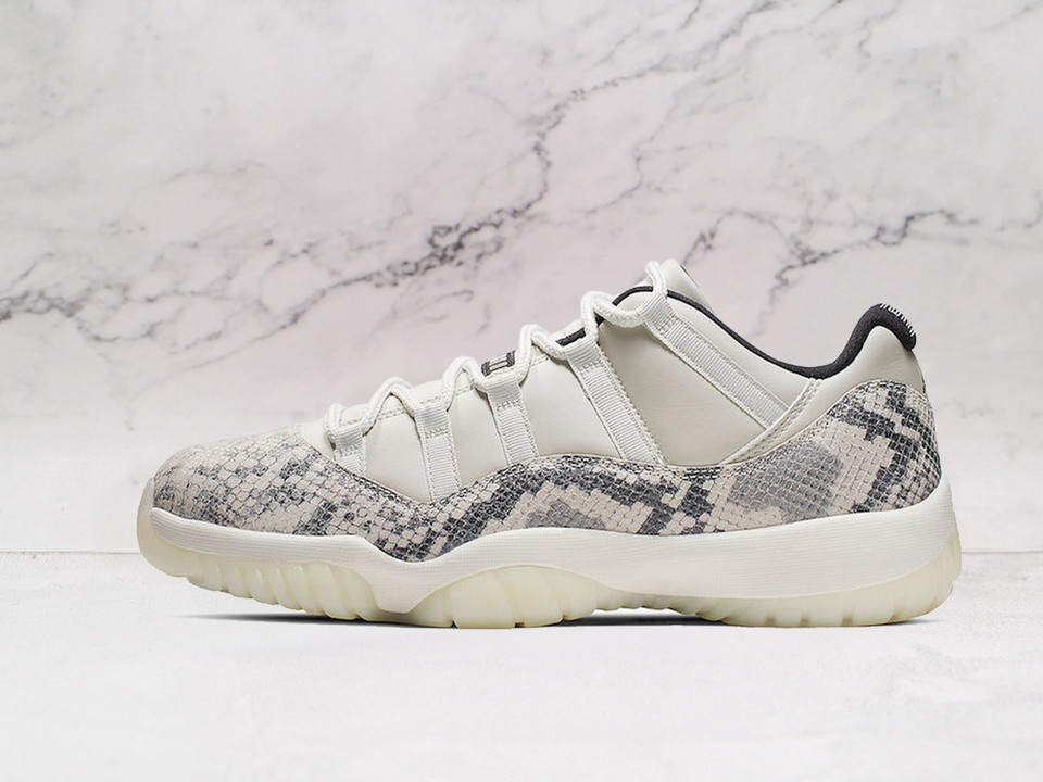 Side view of Air Jordan 11 Retro Low 'Light Bone Snakeskin' with Light Bone leather and snakeskin vinyl overlay