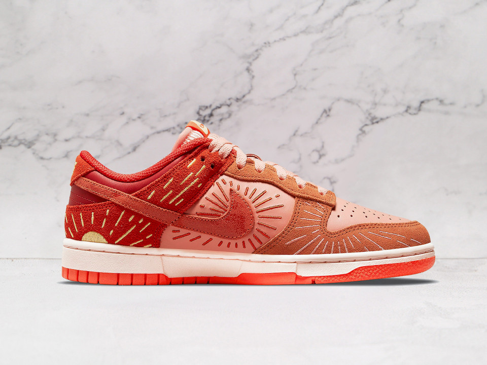 Nike Dunk Low Winter Solstice 2021 – Medial side close-up highlighting the suede and leather construction, warm gradient hues, and embroidered sunray details celebrating the Winter Solstice.