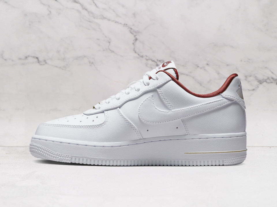 Medial view of Nike Air Force 1 Low Just Do It DV7584-100 with team red accents and white sole Medial view of Nike Air Force 1 Low Just Do It DV7584-100 with team red accents and white sole