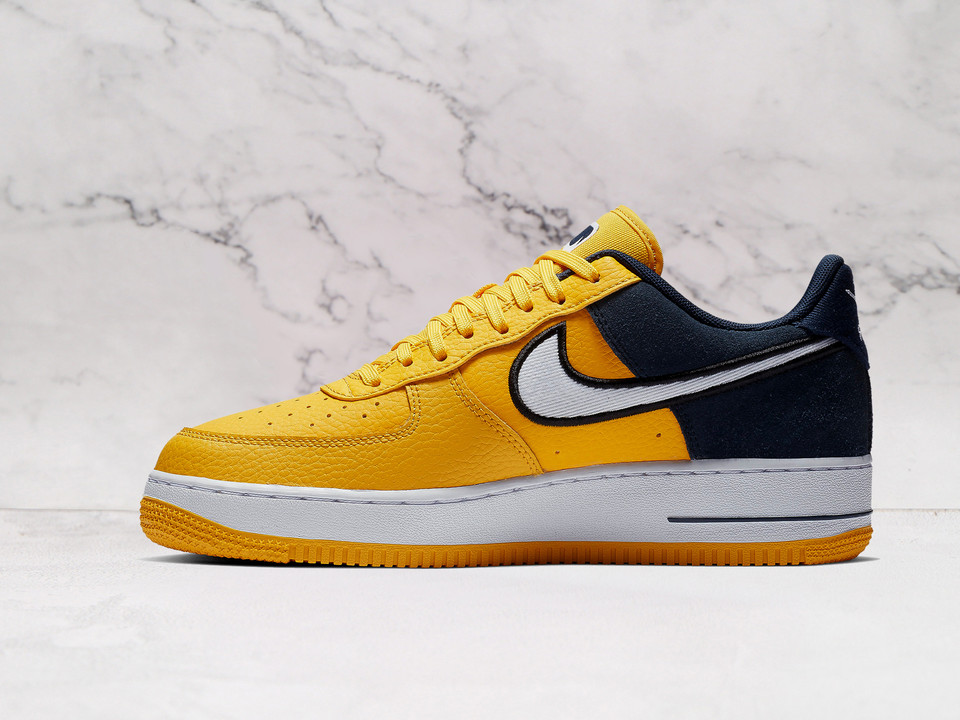 Yellow Nike Air Force 1 Low Amarillo medial view with white Swoosh