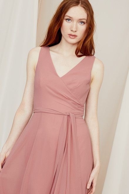 Perfectly draped and ruched to create the illusion of a wrap silhouette, this V-neck bridesmaid dress in smooth chiffon ties at the waist and zips high at the back.