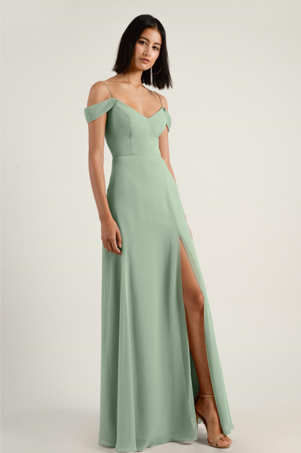 The Priya dress has a flattering soft A line silhouette with a spaghetti strap V neckline in our flowy Luxe Chiffon. An modern off the shoulder folded sleeve slopes into a soft V in the front and back of the bodice. The defined waist gives way to a long skirt with a flirty above the knee princess seam slit. This bridesmaid dress is fully lined with an invisible center back zipper.