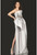 Three-dimensional sculptured bodice has a cascading flower and beads with oversized draped bow skirt.