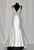 Mikado trumpet gown, scalloped V-neckline front and back, floral embroidered lace bodice with nude sweetheart lining, natural waist, chapel train.