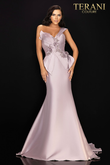Intricately wrapped stretch Mikado mother of the bride gown held in place with tonal 3D flowers and bead detail. Accented with one off shoulder cuffs.